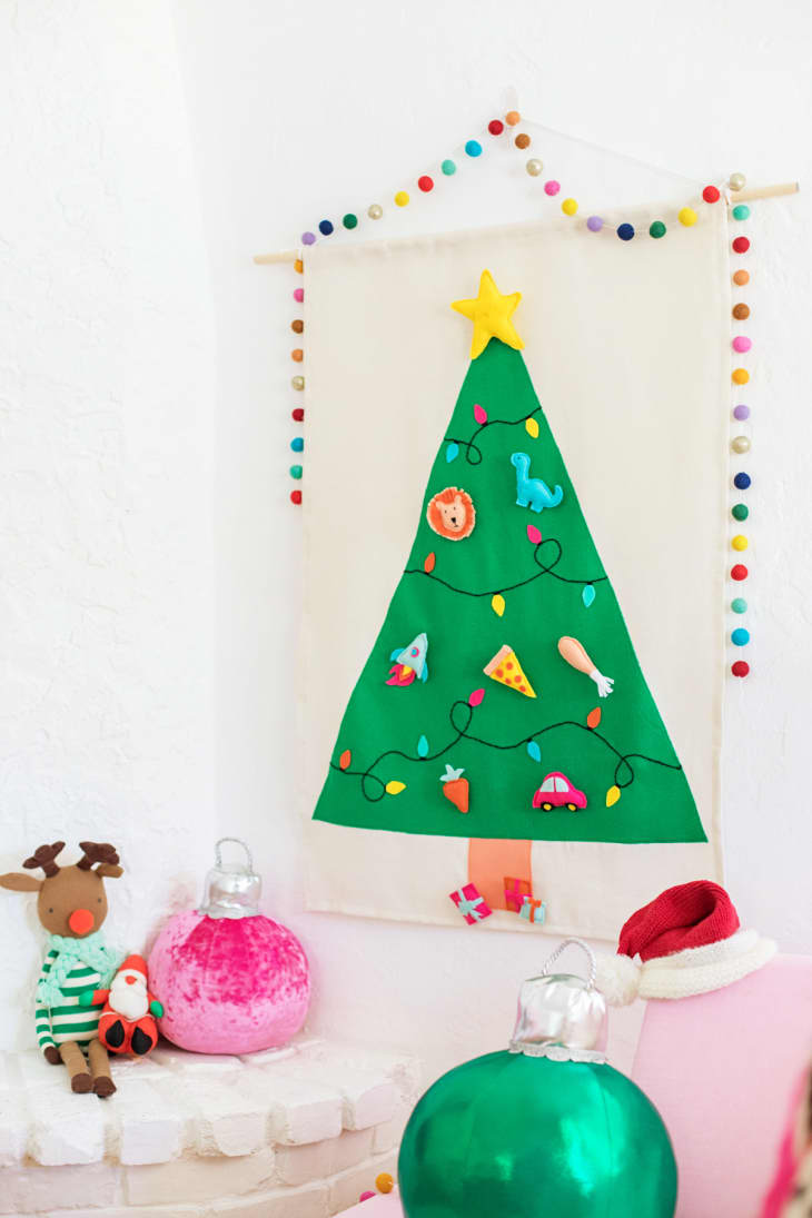 Felt wall hanging of a Christmas tree with velcro ornaments