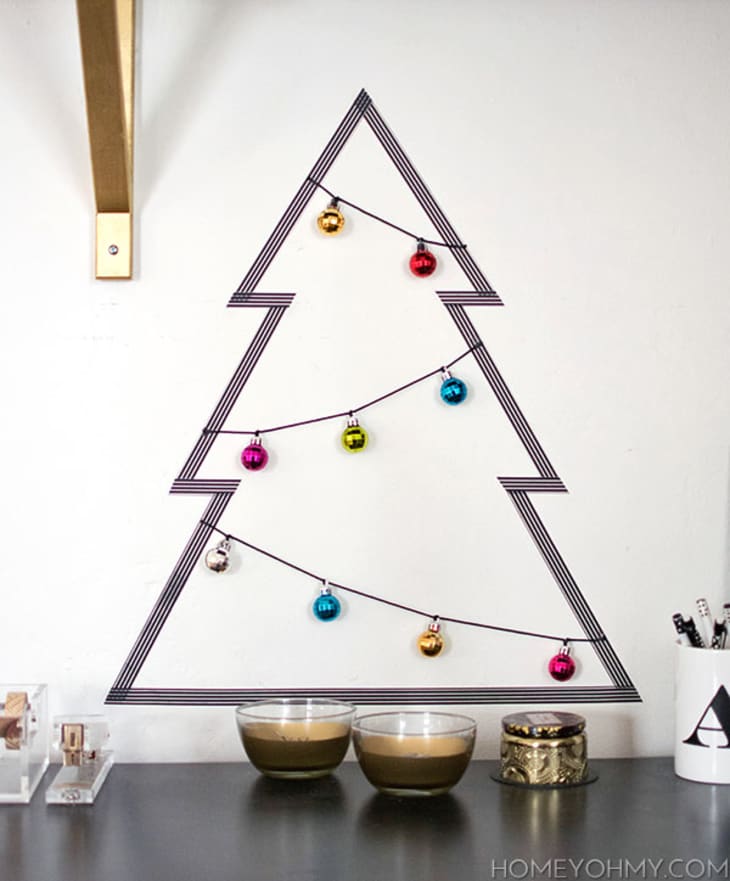 Christmas tree made from washi tape and strung with mini ornaments