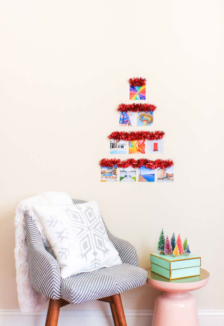 Wall Christmas tree made with tinsel garland and photos