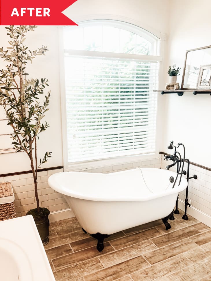 之后:浴室与硬木地板，大窗户，独立浴缸，绿色植物