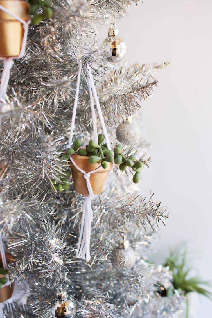 silver Christmas tree with hanging plant ornaments