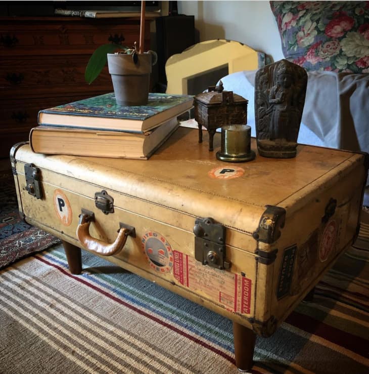 Suitcase coffee table holding vintage finds