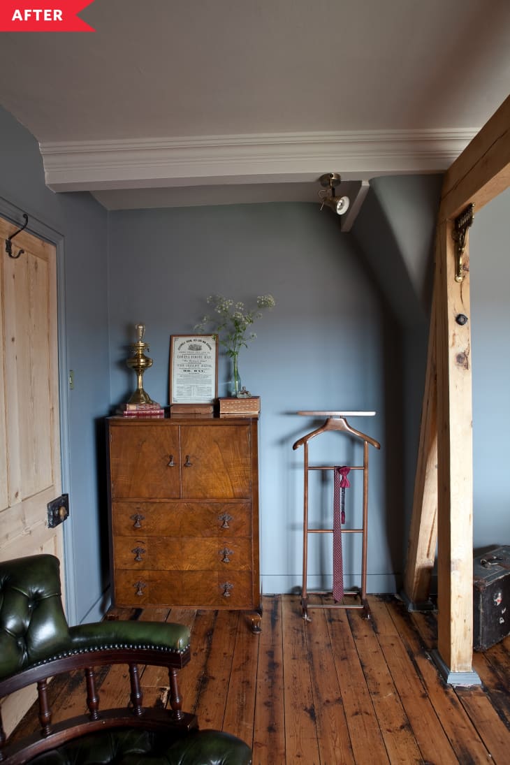 After: blue bedroom with natural wood floors and beam