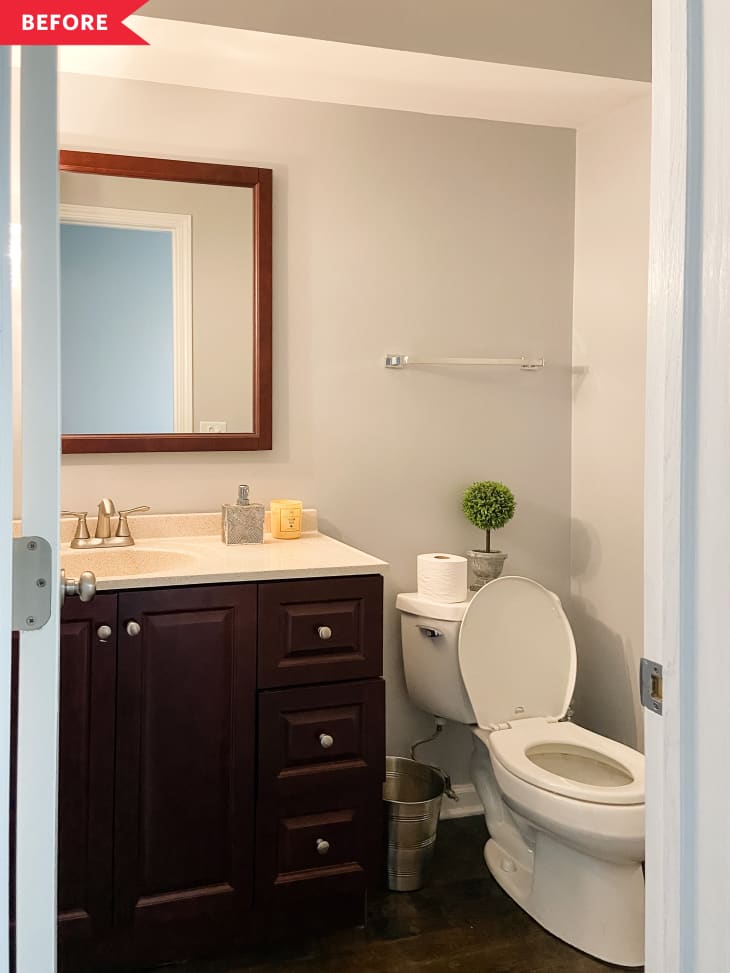 Before: Bathroom with dark wood vanity and white walls