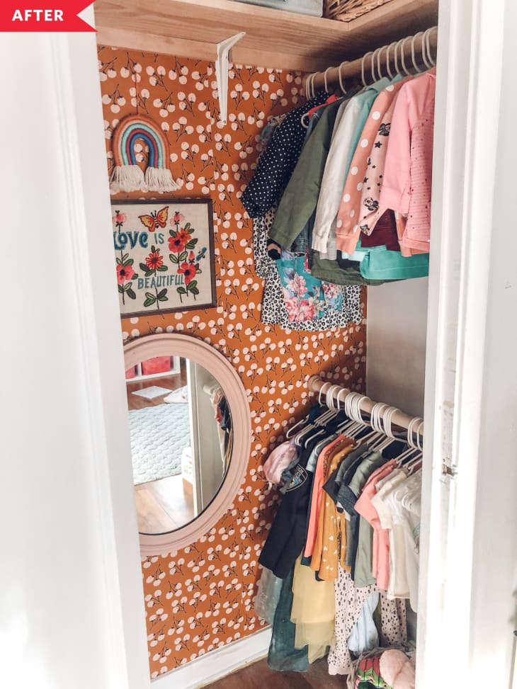 After: wallpapered closet with clothing rods on lower and upper levels of closet