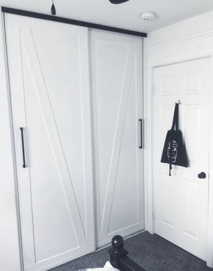 white closet doors with a barn door style