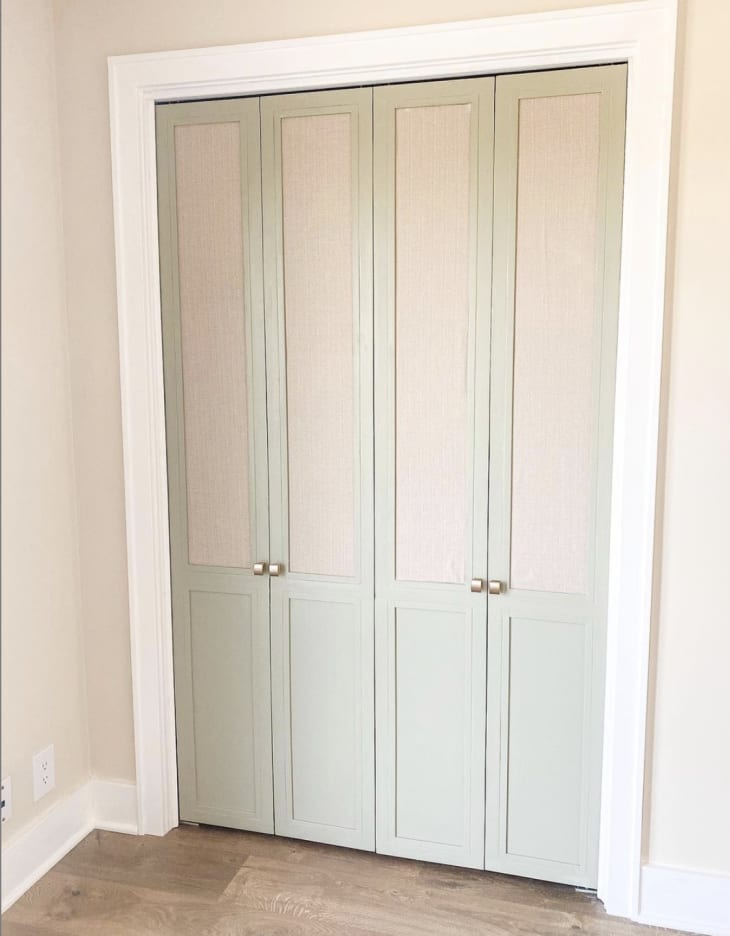 closet doors with fabric inset panels and wood trim