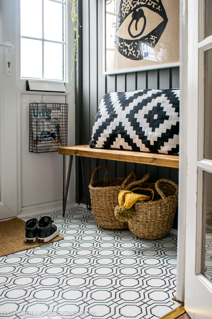 mudroom floor covered in removable wallpaper with a graphic black and white pattern