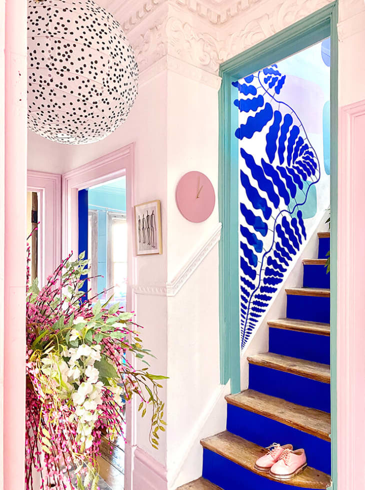 Pink room and staircase with blue risers
