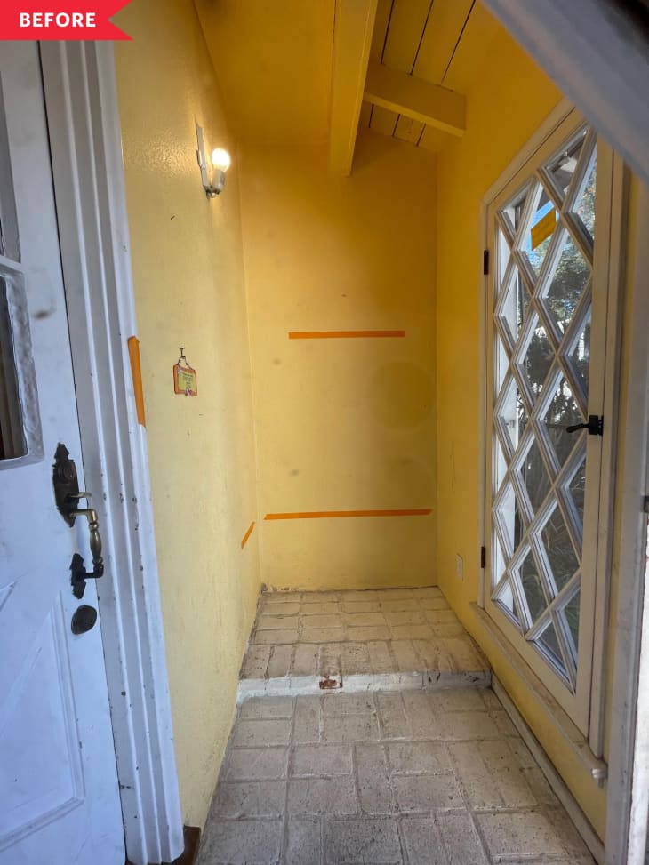 Before: Yellow entryway with lattice window and brick floor