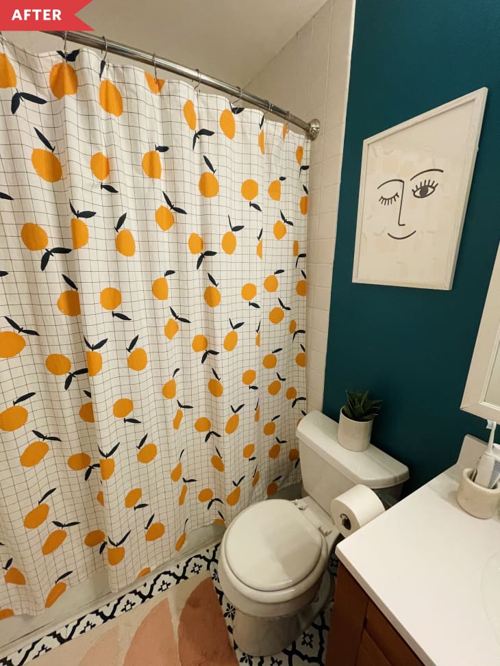 After: Teal bathroom with peach-print shower curtain.