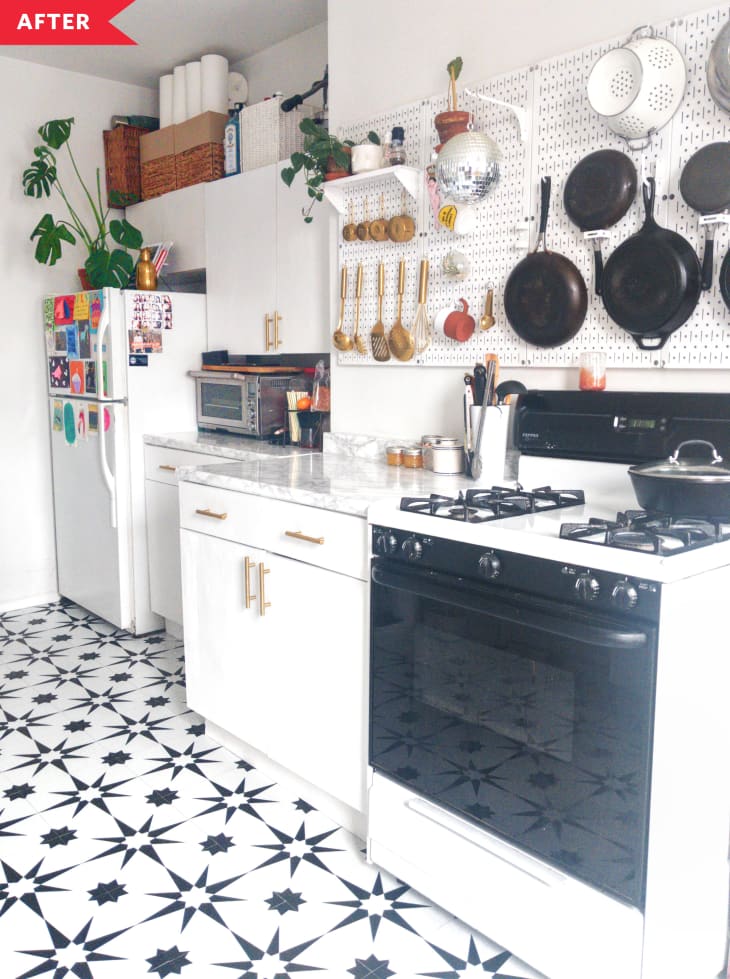 After: Kitchen with white cabinets, faux marble counters, and black and white floor
