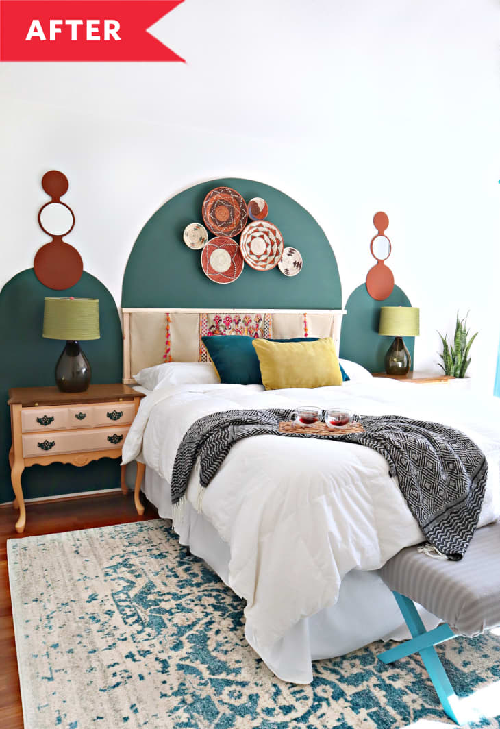 After: Boho bedroom with painted green arches on wall and colorful teal rug