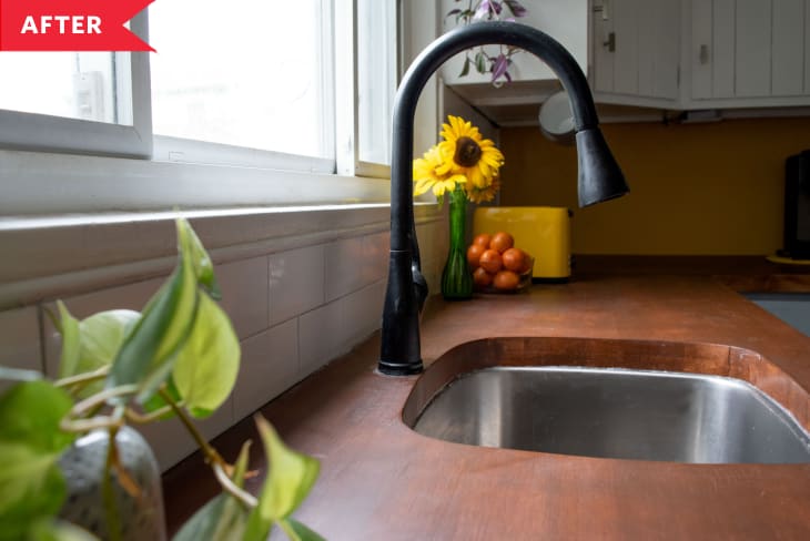 Wooden countertops and new sink with black faucet