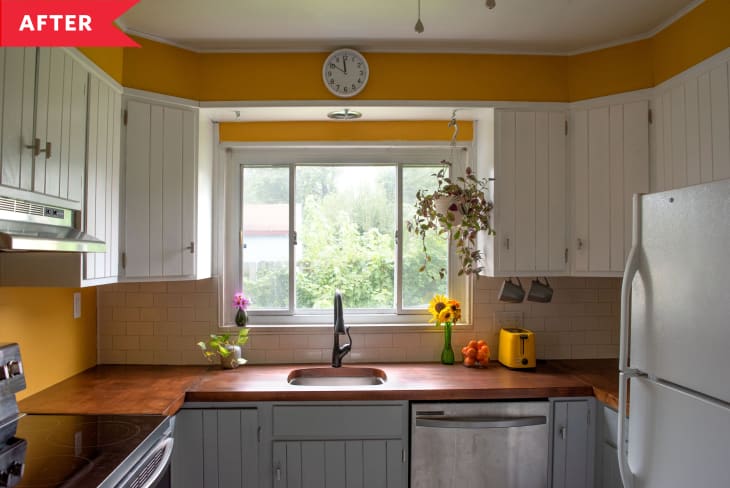 After: Kitchen with yellow walls and window above sink