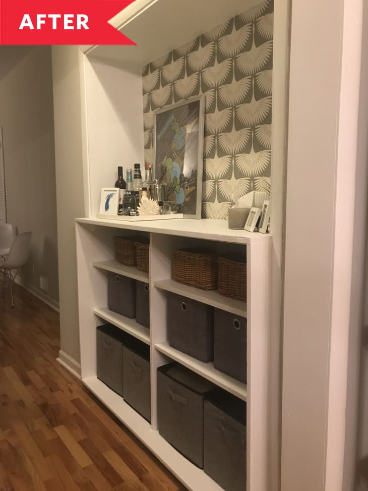 After: Built-in shelving with grayish green and white wallpaper background