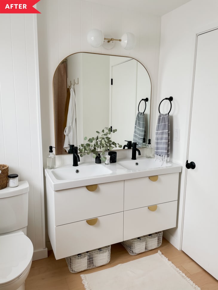 After: Double vanity with drawers, white walls, and wood-look floors