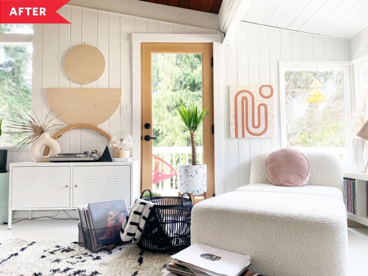 After: Bright white entryway with geometric art on walls and white boucle chaise