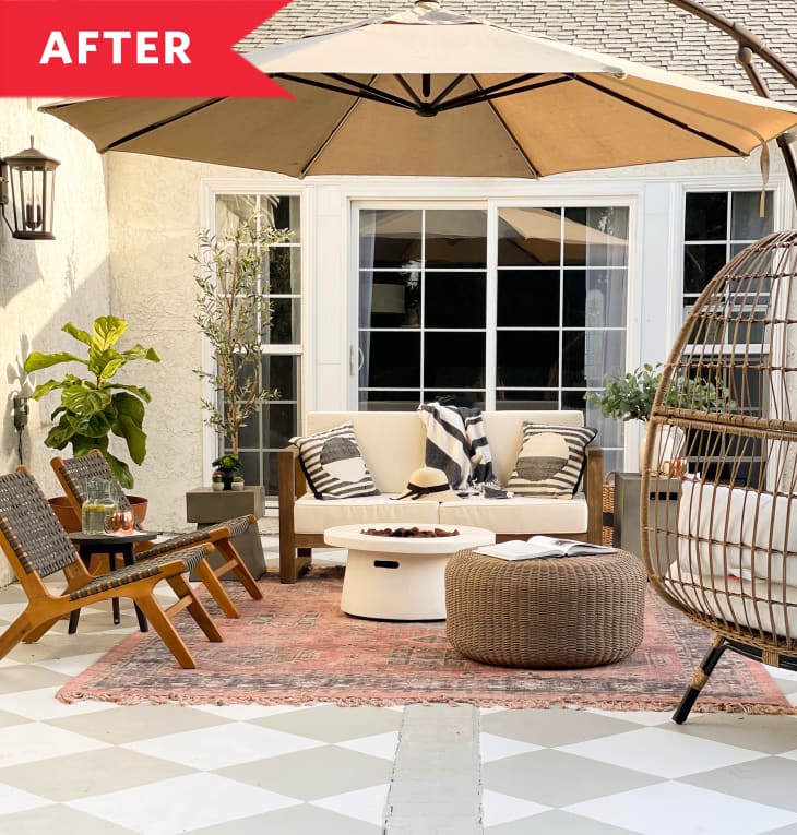 After: Stylishly furnished patio with large umbrella shade and vintage rug
