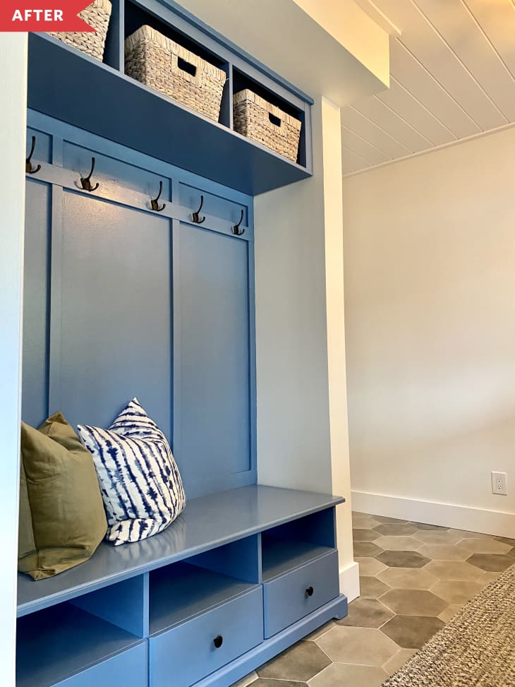 After: Built-ins with cubbies and hooks for coats, painted medium blue