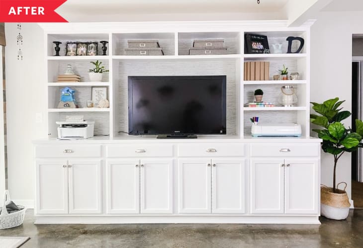 After: Wall of white built-in cabinets with TV in center