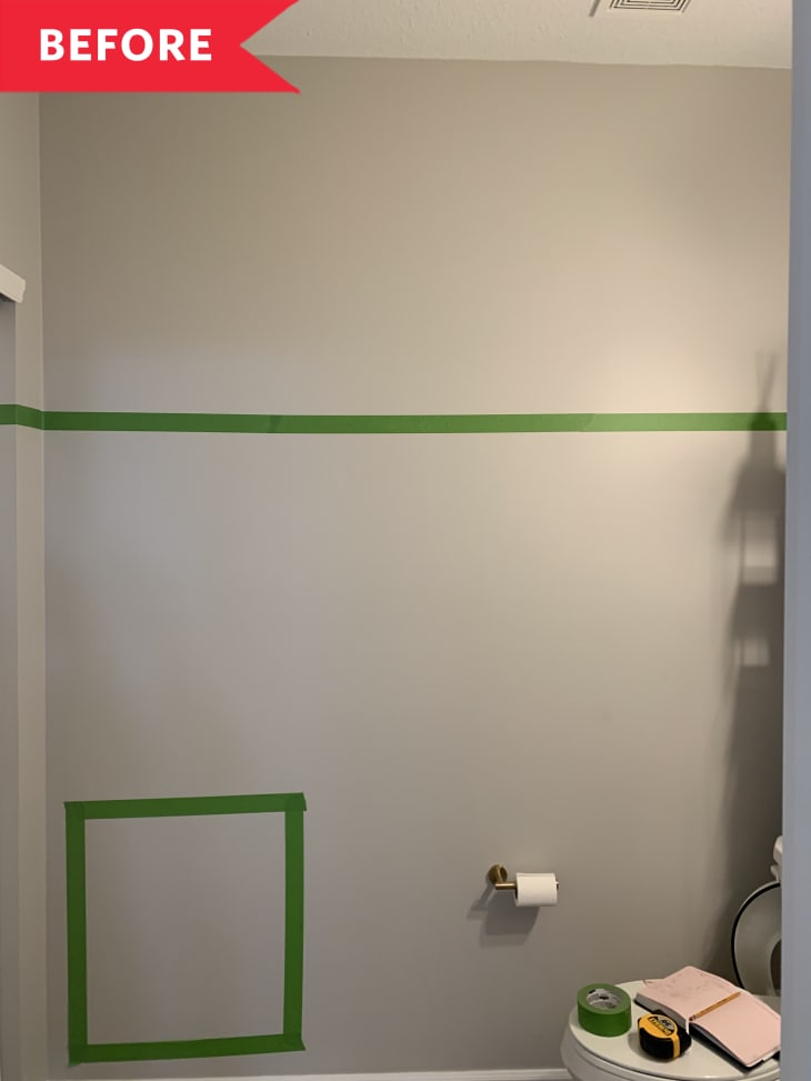 Before: Bathroom with tape on gray walls