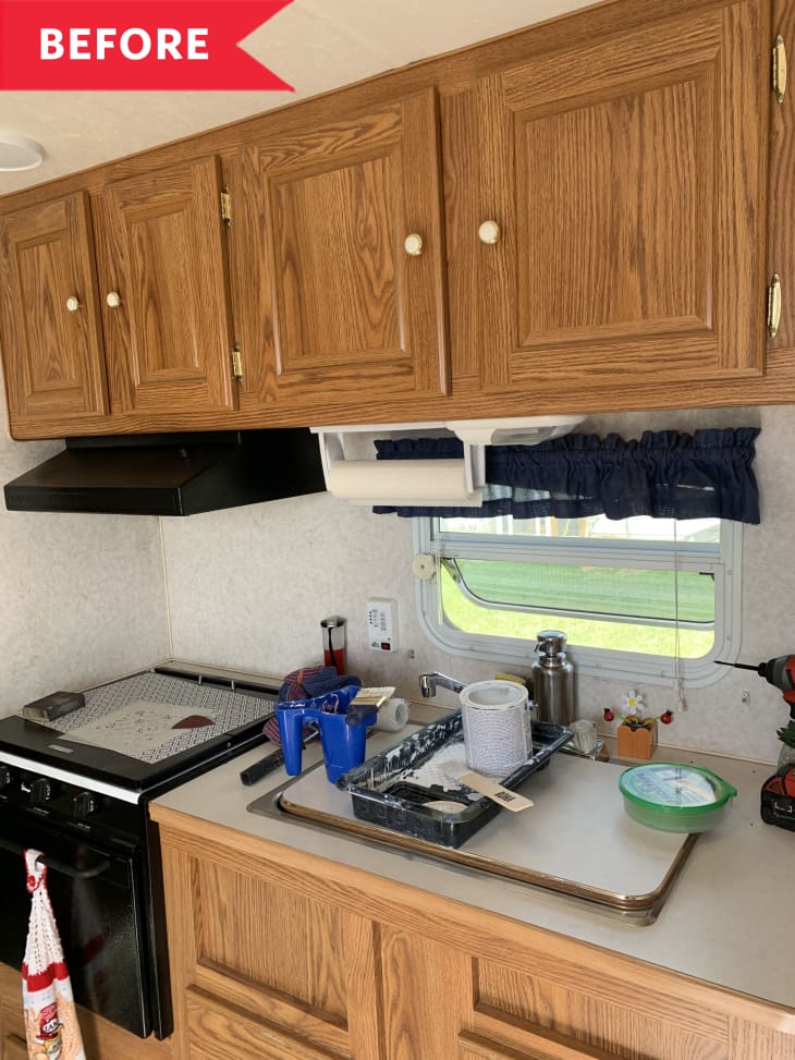 Before: RV kitchen with brown wooden cabinets