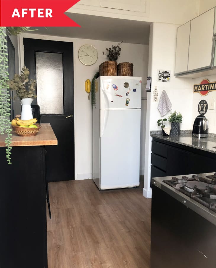 After: Small black and white kitchen with wood floors