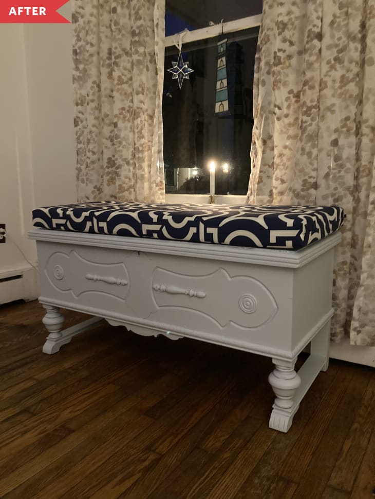 After: Gray painted chest with navy blue and white padded cushion on top