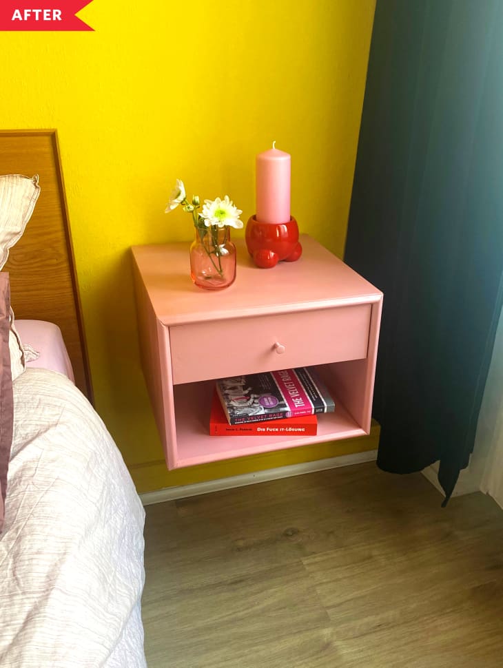 After: pink floating nightstand on a yellow wall