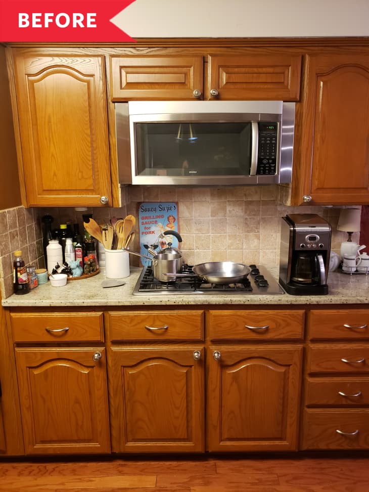 Before: Brown dated cabinets, plus stovetop and microwave, in kitchen