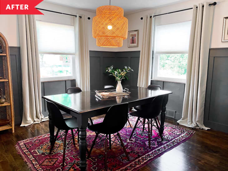 After: Dining room with gray board and batten, white walls, and rattan light fixture above black dining table and vintage rug