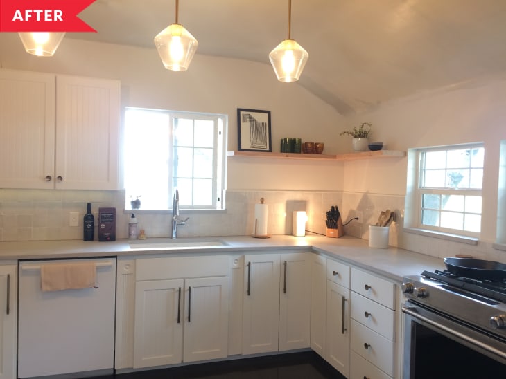 After: After: Kitchen with white cabinets, white walls, and white stacked tile backsplash, plus three modern pendant lights overhead