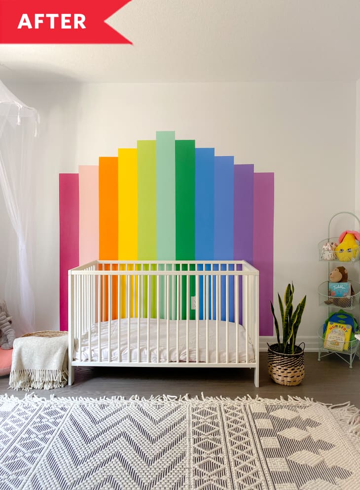 After: Rainbow accent wall behind crib in nursery