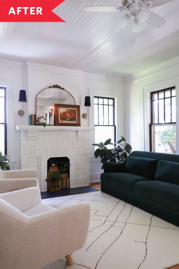 After: Bright living room with white walls, painted white fireplace, green sofa, and boucle armchairs