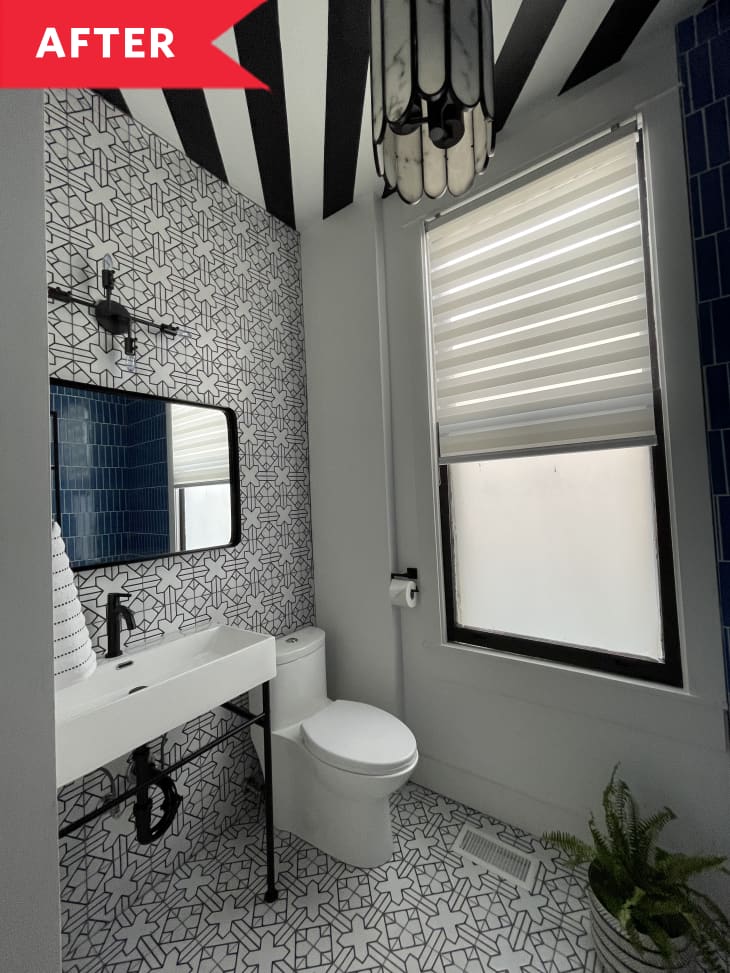 After: Black and white bathroom with tiled wall and floor plus bold striped ceiling