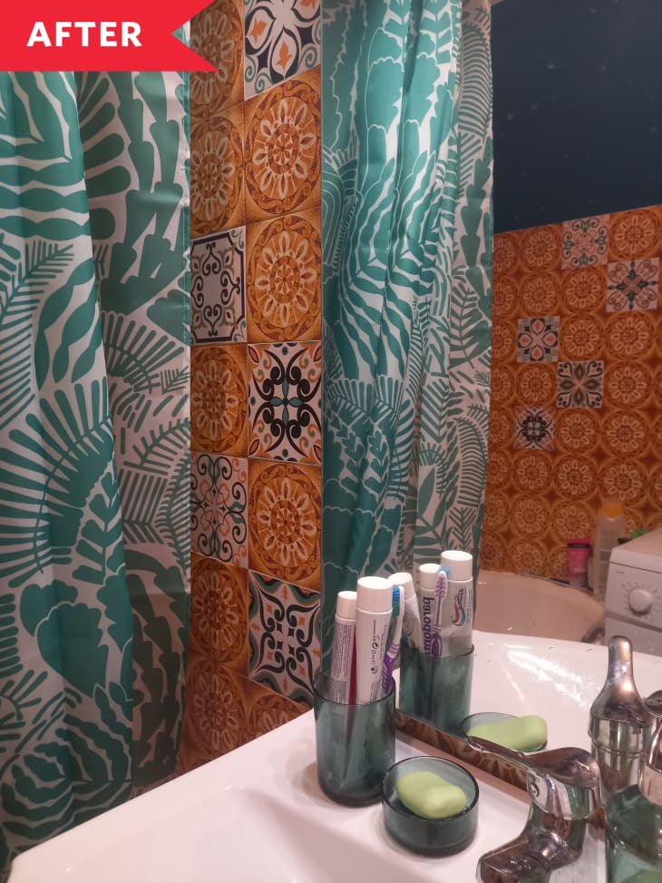 bathroom orange pattern tile blue curtains