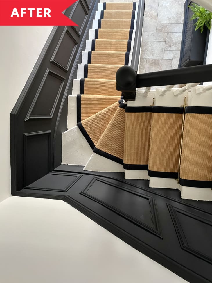 After: Aerial view of staircase with runner in black, white, and tan entryway