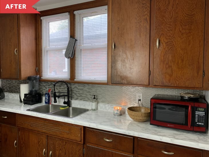 After: Red microwave next to kitchen sink on one side of the kitchen