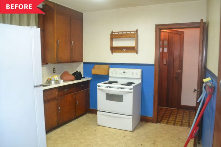 Before: Dated kitchen with lower half of walls painted blue