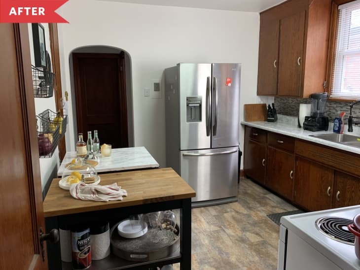 After: Small but functional kitchen with stainless steel refrigerator