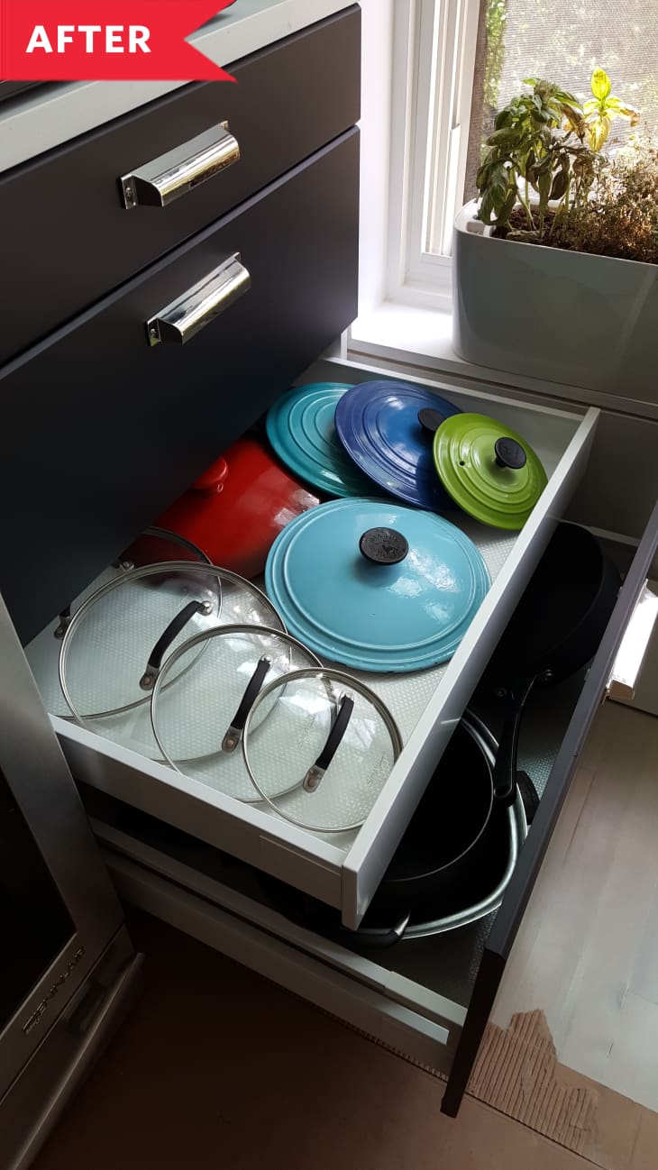 After: Organized pots and pans in kitchen drawer