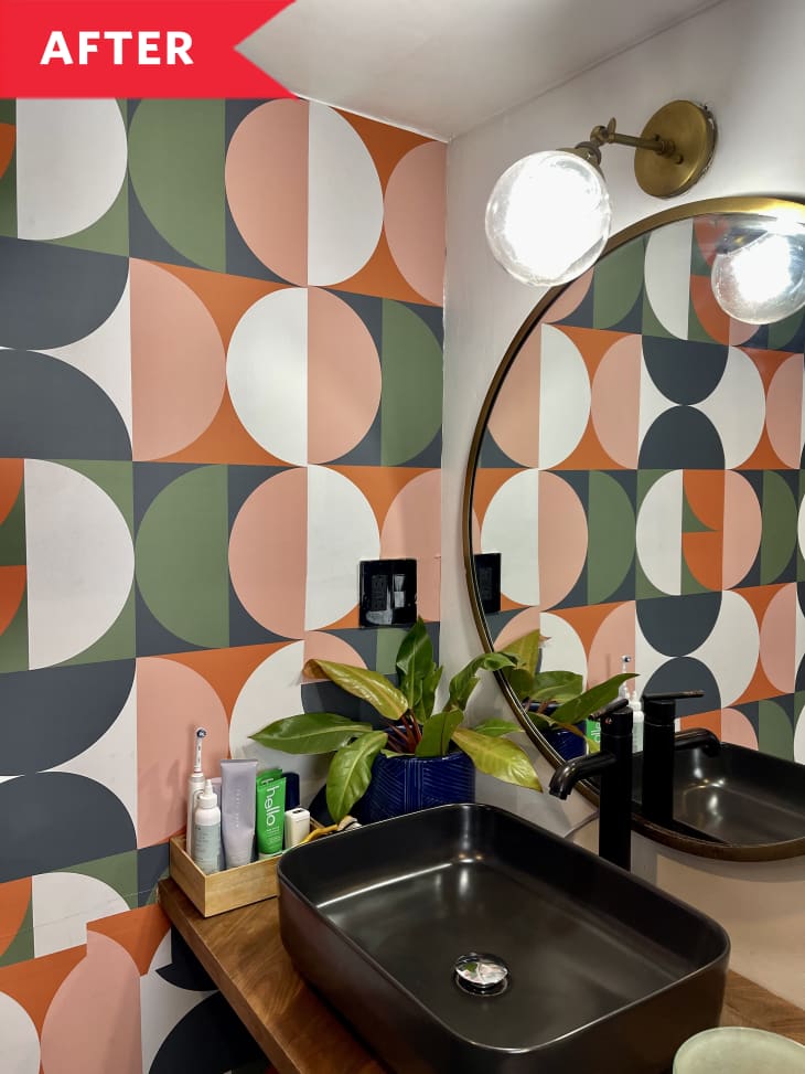 After: Colorful half-circle patterned wallpaper on wall next to bathroom vanity