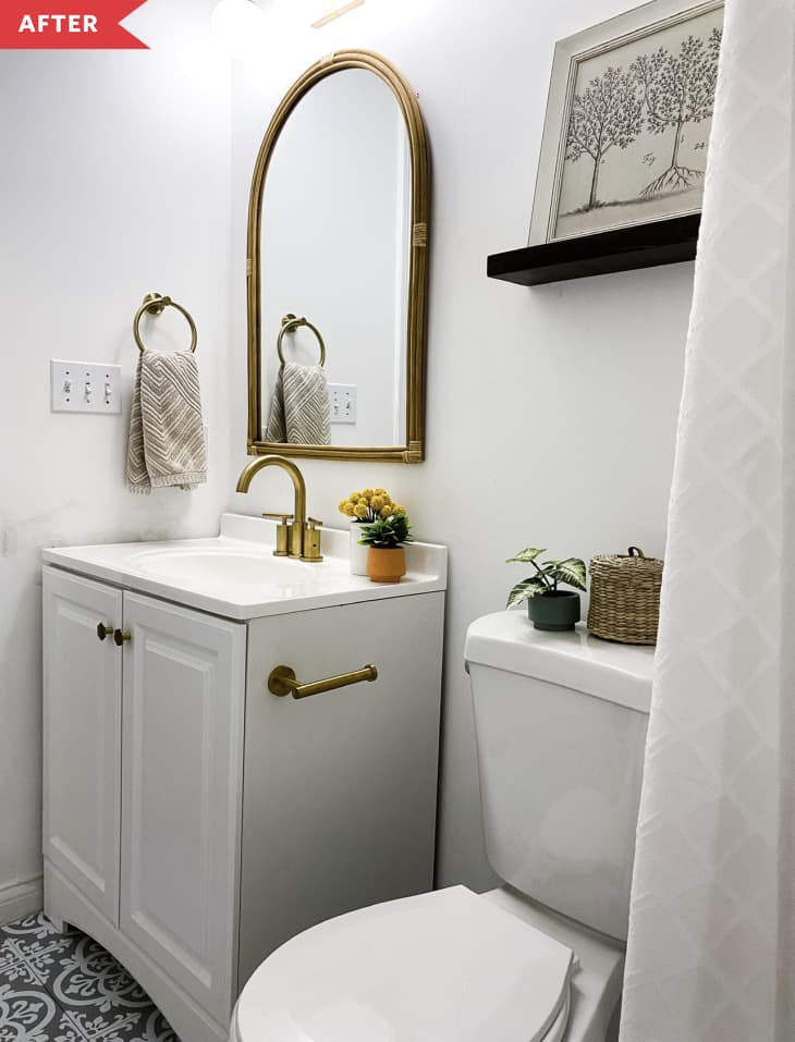 After: Bathroom with white vanity and patterned tile floor