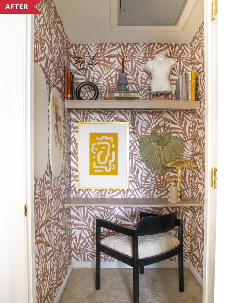 After: Closet office with wallpapered walls in a terracotta colored palm leaf pattern, plus a built-in desk and a chair