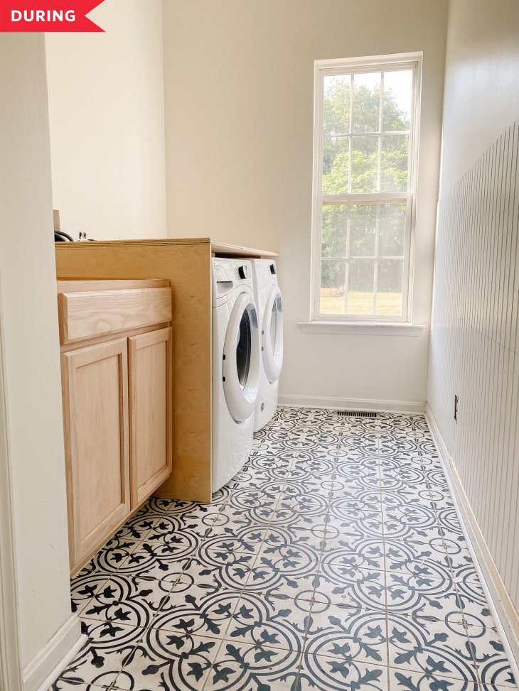 During: Laundry room with yellowy wood cabinets and patterned tile floors