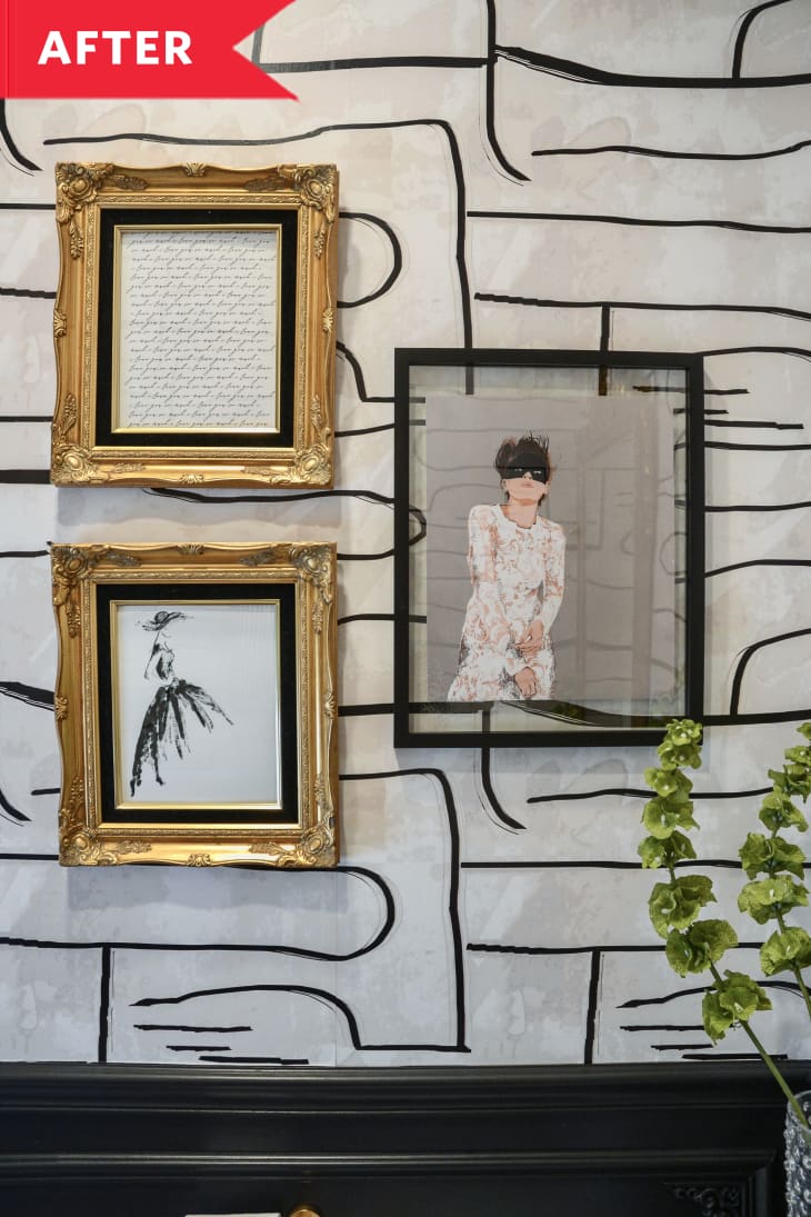 After: Frames hanging on black and white wallpapered wall