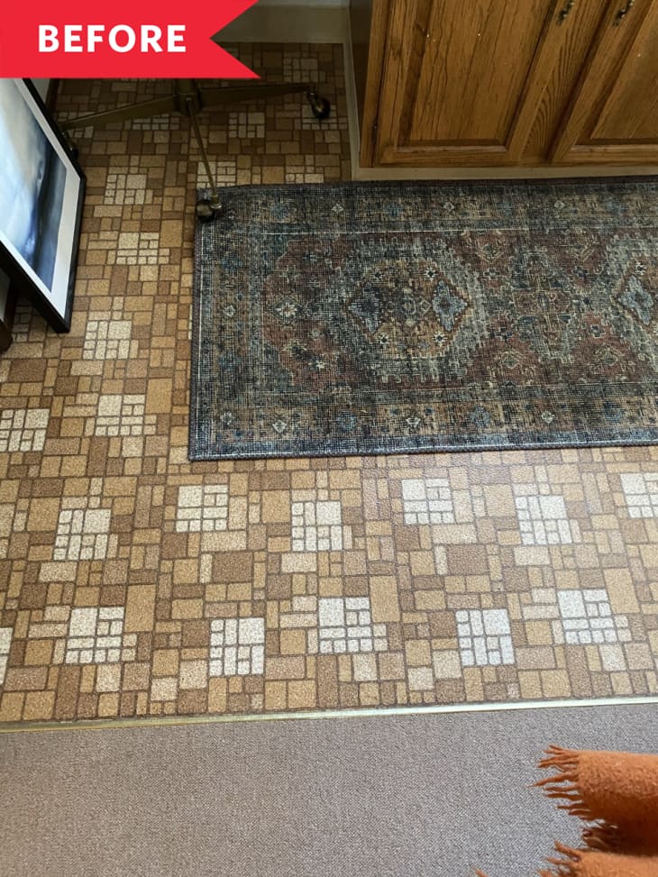brown and white pattern tile floors with dirty blue rug