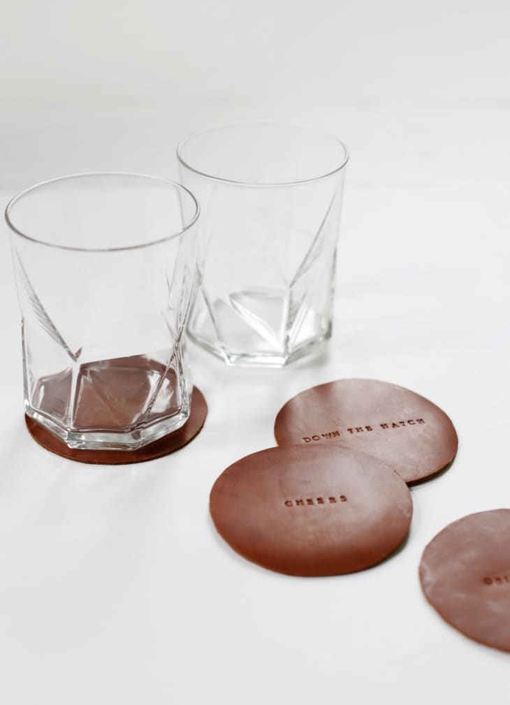 DIY brown leather coasters stamped with various phrases