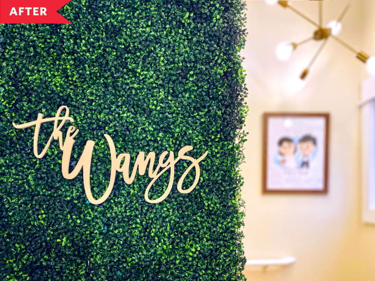 After: Sign that says "The Wangs" hanging on greenery wall